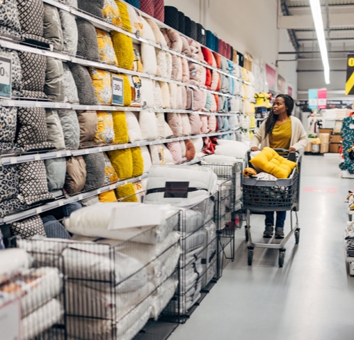 Shopper browsing and selecting pillows