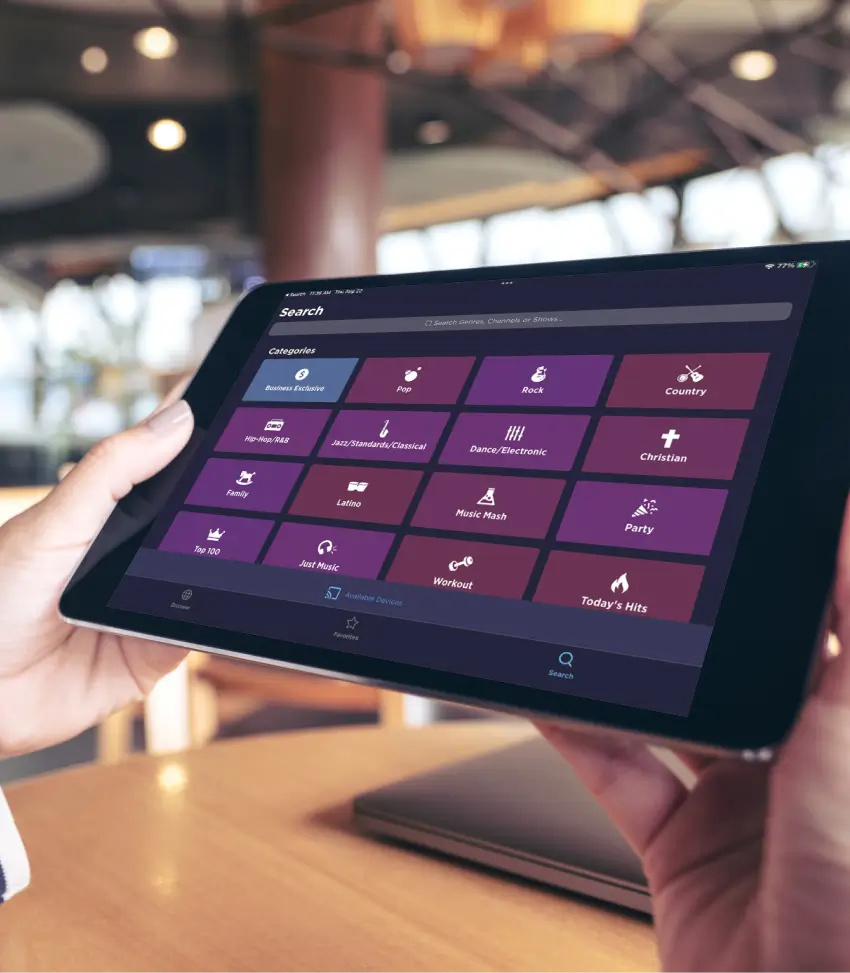Close up of two hands holding a tablet with category options.