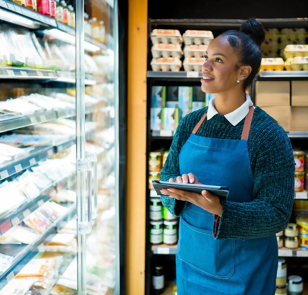 Woman selecting retail music for food stores